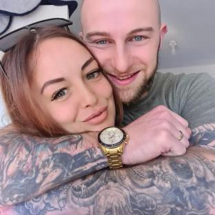 A photo of a couple embracing.