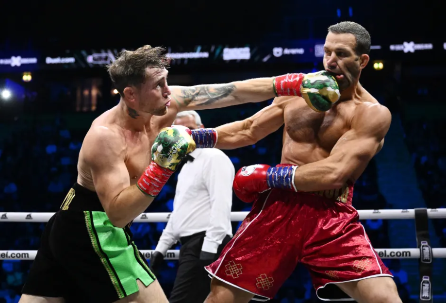 Two boxers fighting in the ring.