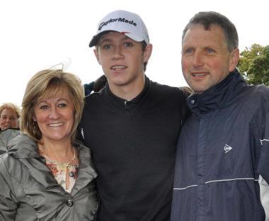 Niall Horan with his parents.