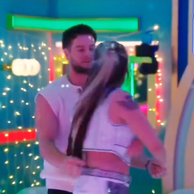 JoJo Siwa slapping Chris Hughes's buttock.