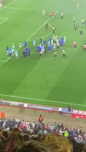 Frank Lampard reacting angrily to a pitch invader asking for a selfie.