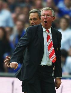 Sir Alex Ferguson, manager of Manchester United, reacts to a denied penalty kick.