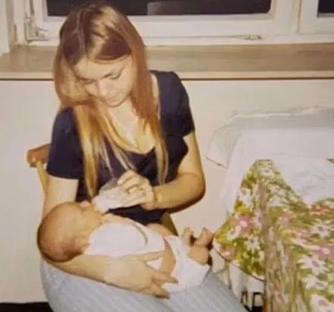 Woman bottle-feeding a baby.