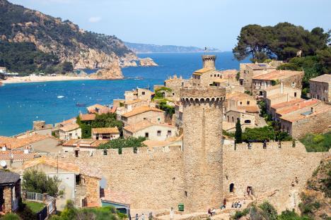 View of Tossa de Mar's historic walled village on the Costa Brava, Spain, overlooking the sea.