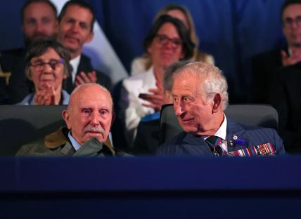 King Charles III and a veteran at a VE Day concert.