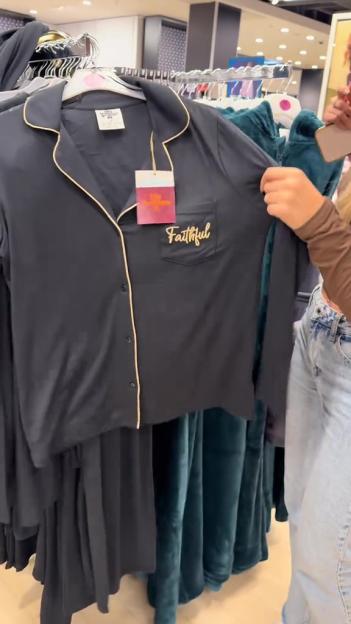 A black long-sleeve pajama shirt with gold trim and the word "Faithful" embroidered on the pocket.