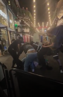 A bouncer being punched during a bar brawl.