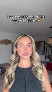 Woman in Spain discussing her utility bills.