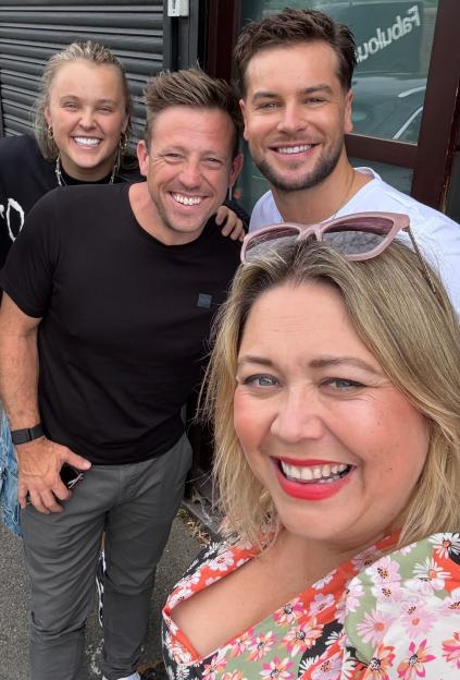 Group photo of four people.