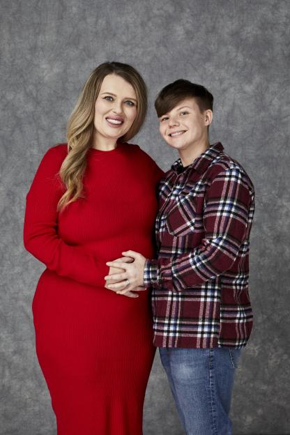 Photo of a pregnant woman and her partner.