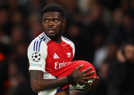 Thomas Partey of Arsenal holding a soccer ball.