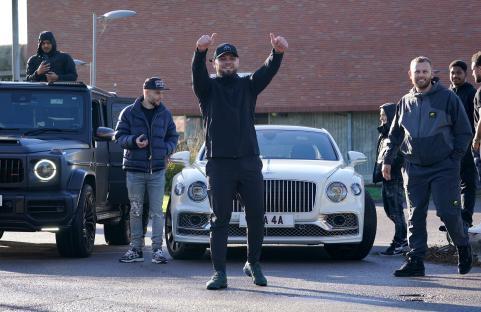 A man gives a thumbs-up as he is released from prison.