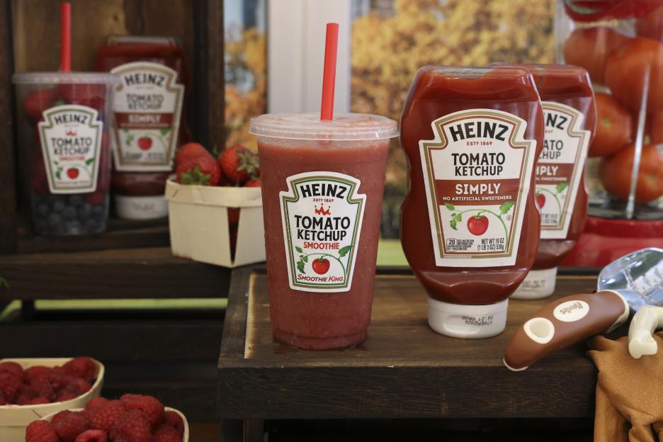 Heinz tomato ketchup smoothie next to bottles of Heinz ketchup.