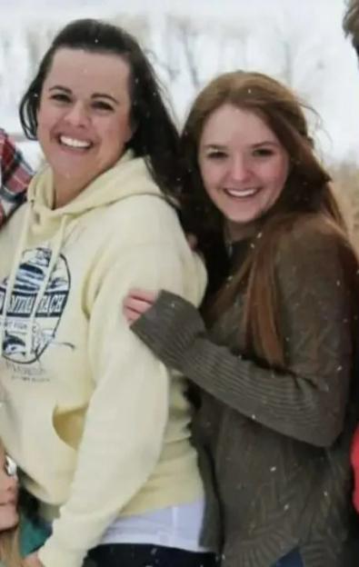 Angela Craig (left) standing next to a young woman in the snow.