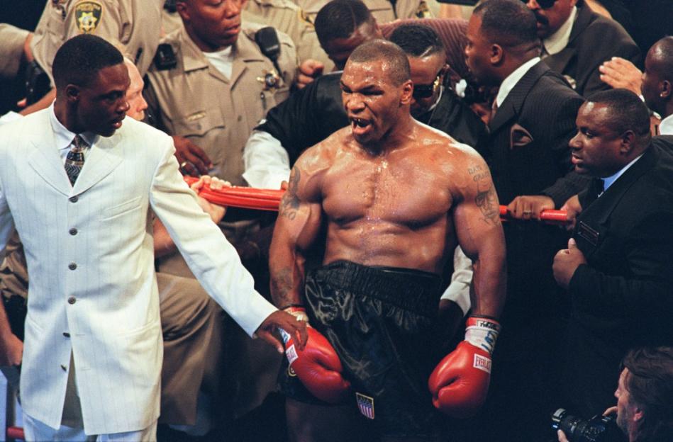 Mike Tyson reacts after being disqualified at the end of the third round of his fight with WBA heavyweight champion Evander Holyfield in the MGM Grand Garden Arena 28 June 1997. Holyfield won by disqualification after being bitten by Tyson. AFP PHOTO/JOHN GURZINSKY / AFP PHOTO / JOHN GURZINSKI (Photo credit should read JOHN GURZINSKI/AFP via Getty Images)