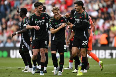 Arsenal players celebrating a goal.