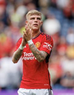 Brandon Williams of Manchester United applauding.