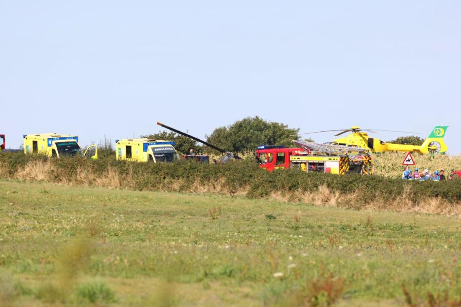 Emergency responders at the scene of a helicopter crash.