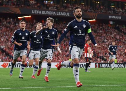 Manchester United players celebrating a goal.