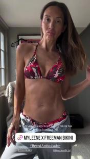 Myleene Klass modeling a red and green floral bikini.