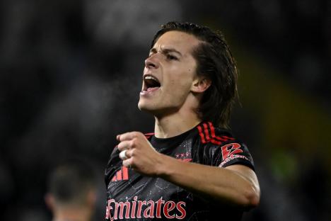 Benfica's Spanish defender #03 Alvaro Fernandez Carreras celebrates after scoring during the Portuguese League football match between Vitoria Guimaraes SC and SL Benfica at the Dom Afonso Henriques stadium in Guimaraes, Portugal, on April 19, 2025. (Photo by MIGUEL RIOPA / AFP) (Photo by MIGUEL RIOPA/AFP via Getty Images)