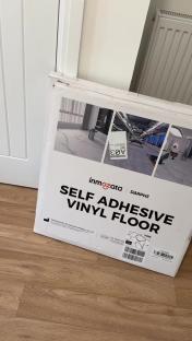 Box of self-adhesive vinyl floor.