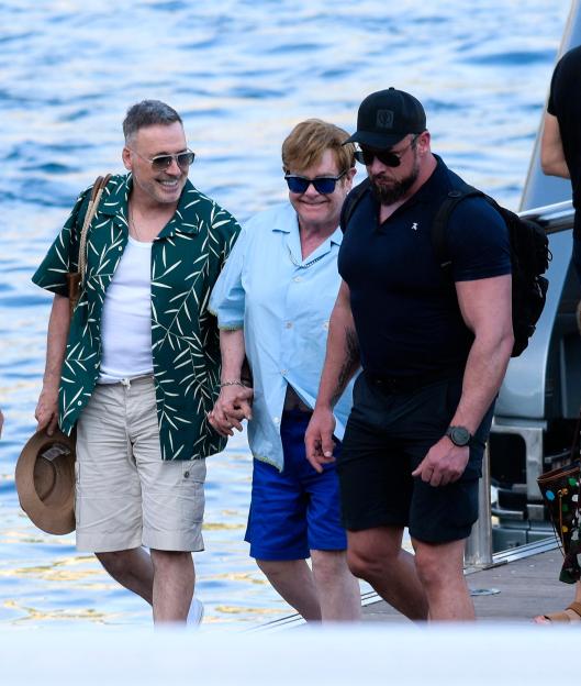 Elton John and David Furnish leaving a yacht.