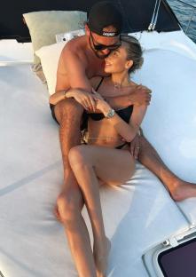 Couple embracing on a boat.