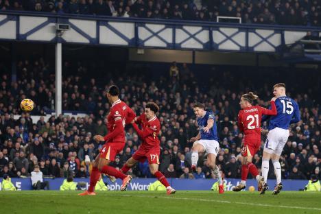 James Tarkowski scoring a goal for Everton.