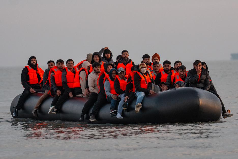 Migrants in a dinghy crossing the English Channel.