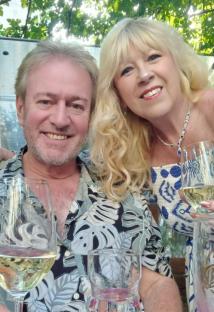 Couple enjoying wine outdoors.