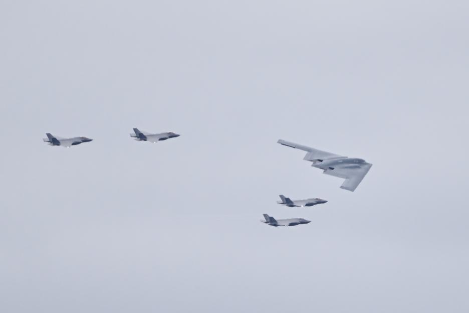 F-35 jets and a B-2 bomber in flight.