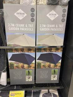 Two boxes of 2.7m crank and tilt garden parasols.