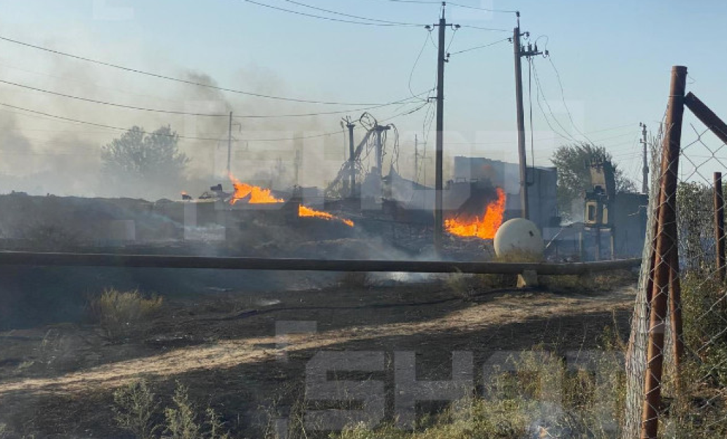 Large fire burning near power lines.