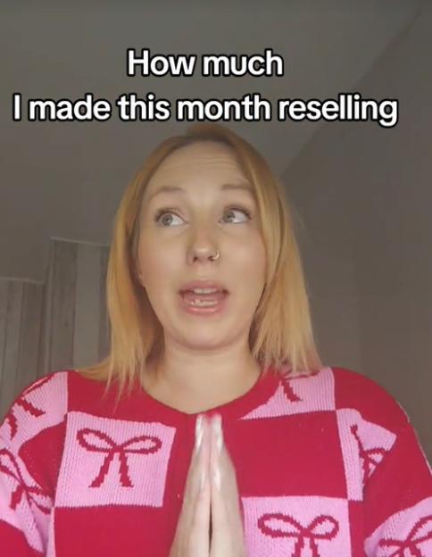 A woman in a red and pink sweater with bow patterns, looking up with her hands clasped, with text that reads "How much I made this month reselling".