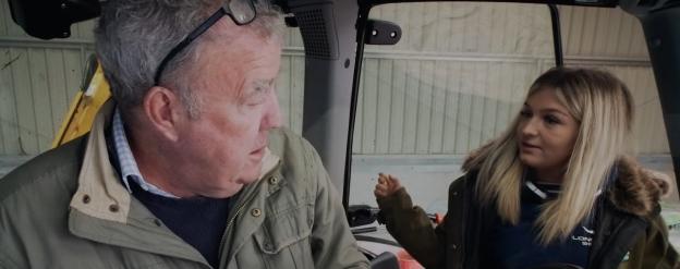 Jeremy Clarkson and his farmhand Harriet Cowan in a tractor.