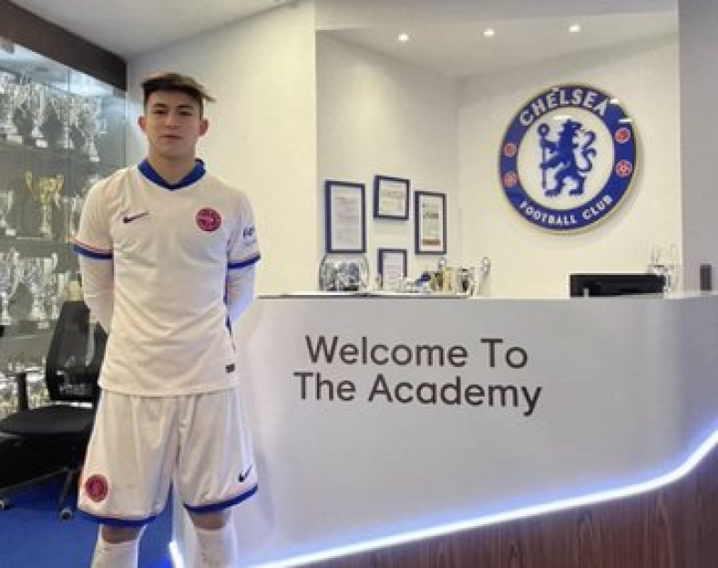 Soccer player in Chelsea academy uniform.