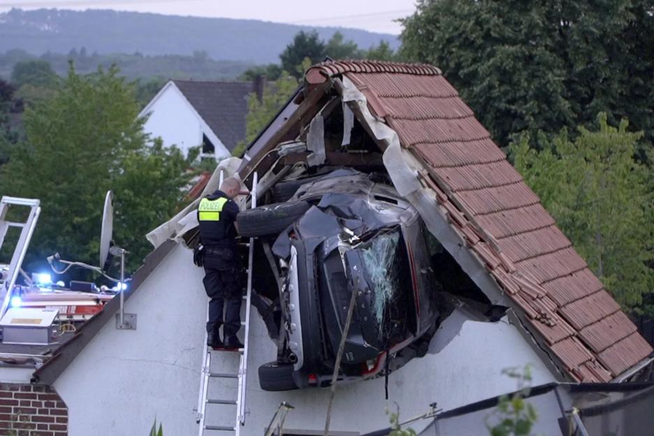 Boy, 7, fighting for life after car ploughs into trampoline in garden before going airborne and smashing into house