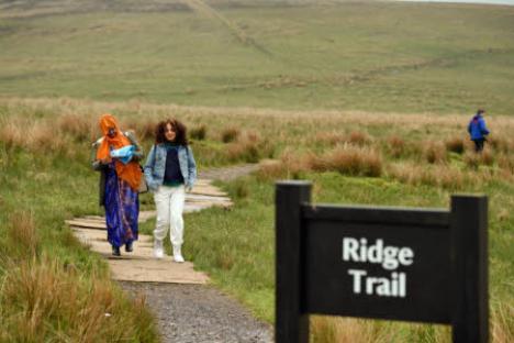 Two women walking on a Ridge Trail.