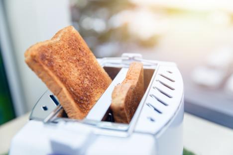 Toast popping up from a toaster.