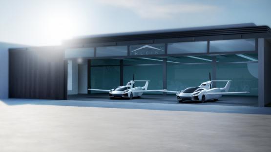 Artist impression of two AirCar prototypes in a hangar.