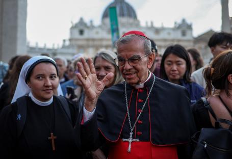 Cardinal Gregorio Rosa Chavez waving near St. Peter's Square.