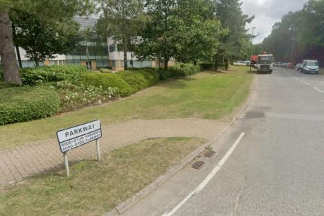 Woman stabbed in stomach at office left fighting for her life as man, 37, arrested for attempted murder