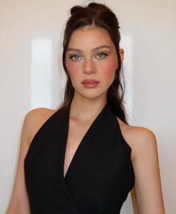 Nicola Peltz in a black halter top.