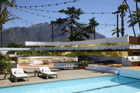 Love Island All Stars villa with pool and seating area.