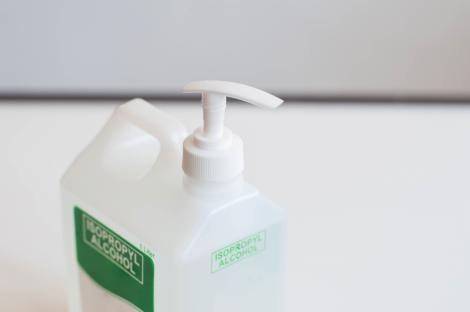 Close-up of a pump bottle of isopropyl alcohol.