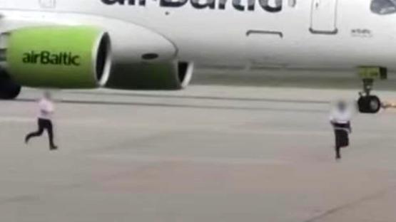 Shocking moment man is chased across taxiway at Heathrow Airport near moving aircraft before being arrested