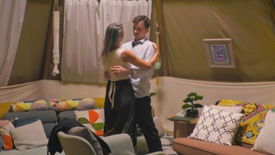 Couple embracing in a teepee.