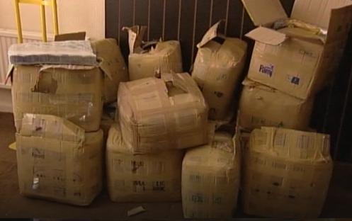 Police raid revealing over £2 million worth of illegal medicines in cardboard boxes.