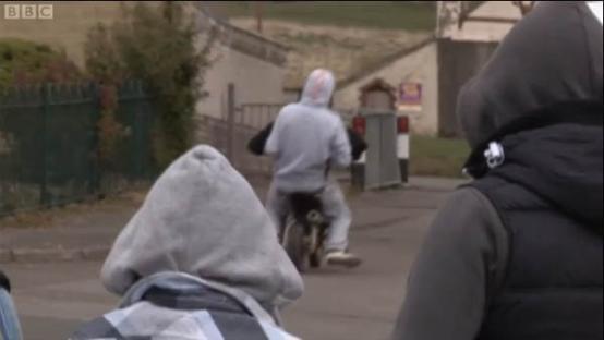 Person on a motorbike in Rhymney.